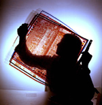 An engineer examines a chip layout